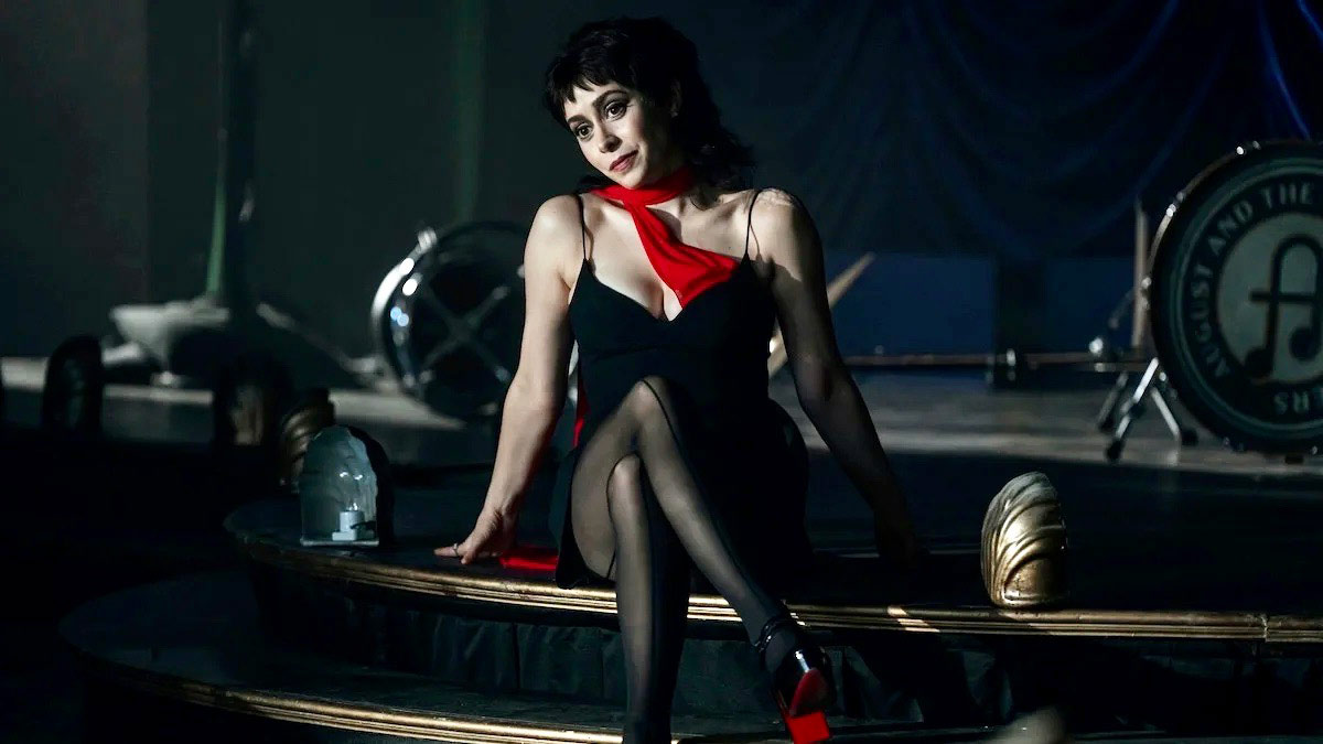 Sofia Falcone - black dress with red scarf